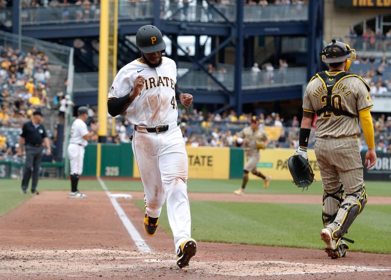 Aug 8, 2024; Pittsburgh, Pennsylvania, USA;  Pittsburgh Pirates left fielder Bryan De La Cruz (41) crosses home plate to score a run against the San Diego Padres during the sixth inning at PNC Park. Mandatory Credit: Charles LeClaire-USA TODAY Sports