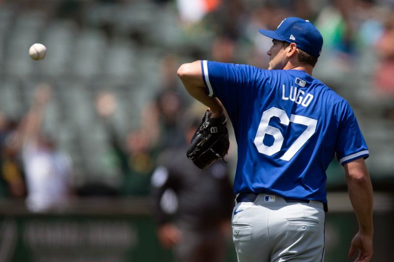 Jun 20, 2024; Oakland, California, USA; Kansas City Royals starting pitcher Seth Lugo (67) gets a new baseball after giving up a two-run home to Oakland Athletics second baseman Zack Gelof (not pictured) during the seventh inning at Oakland-Alameda County Coliseum. Mandatory Credit: D. Ross Cameron-USA TODAY Sports