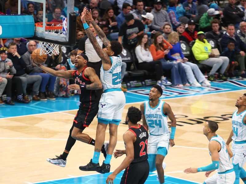 CHARLOTTE, NC - JANUARY 1: Bruce Brown #11 of the Toronto Raptors drives to the basket during the game against the Charlotte Hornets on January 1, 2024 at Spectrum Center in Charlotte, North Carolina. NOTE TO USER: User expressly acknowledges and agrees that, by downloading and or using this photograph, User is consenting to the terms and conditions of the Getty Images License Agreement. Mandatory Copyright Notice: Copyright 2024 NBAE (Photo by Kent Smith/NBAE via Getty Images)