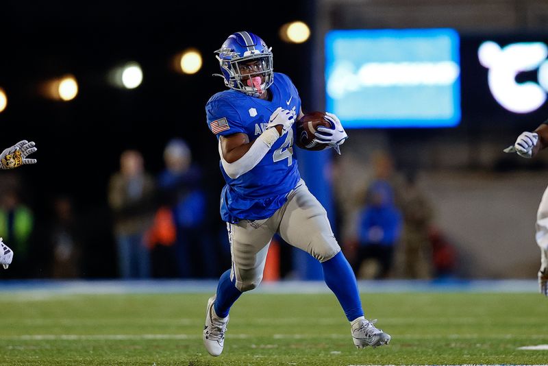 Oct 14, 2023; Colorado Springs, Colorado, USA; Air Force Falcons fullback Emmanuel Michel (4) runs the ball in the fourth quarter against the Wyoming Cowboys at Falcon Stadium. Mandatory Credit: Isaiah J. Downing-USA TODAY Sports