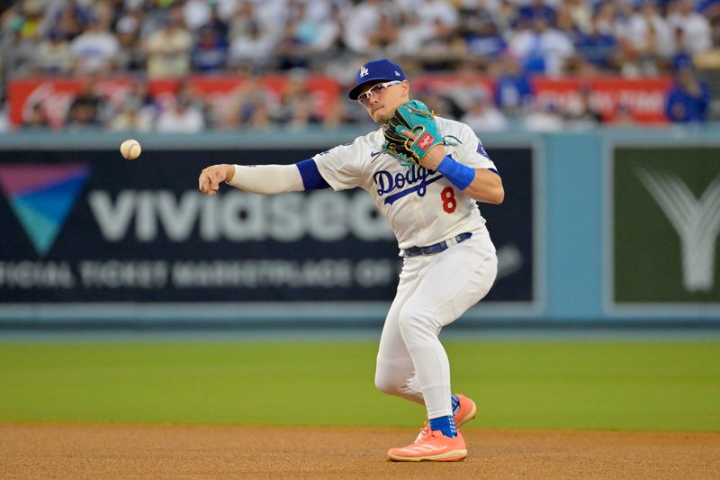 Oct 26, 2024; Los Angeles, California, USA; Los Angeles Dodgers outfielder Enrique Hernandez (8) throws to first for an out against New York Yankees second baseman Gleyber Torres (not pictured) in the third inning during game two of the 2024 MLB World Series at Dodger Stadium. Mandatory Credit: Jayne Kamin-Oncea-Imagn Images