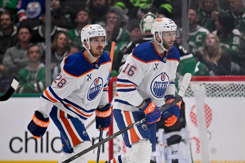 Mar 12, 2026; Dallas, Texas, USA; Edmonton Oilers center Jack Roslovic (28) and center Jason Dickinson (16) skate off the ice after Dickinson scores a goal against the Dallas Stars during the second period at the American Airlines Center. Mandatory Credit: Jerome Miron-Imagn Images