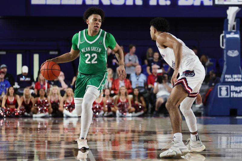Jan 28, 2024; Boca Raton, Florida, USA; North Texas Mean Green guard CJ Noland (22) dribbles the basketball against the Florida Atlantic Owls during the first half at Eleanor R. Baldwin Arena. Mandatory Credit: Sam Navarro-USA TODAY Sports