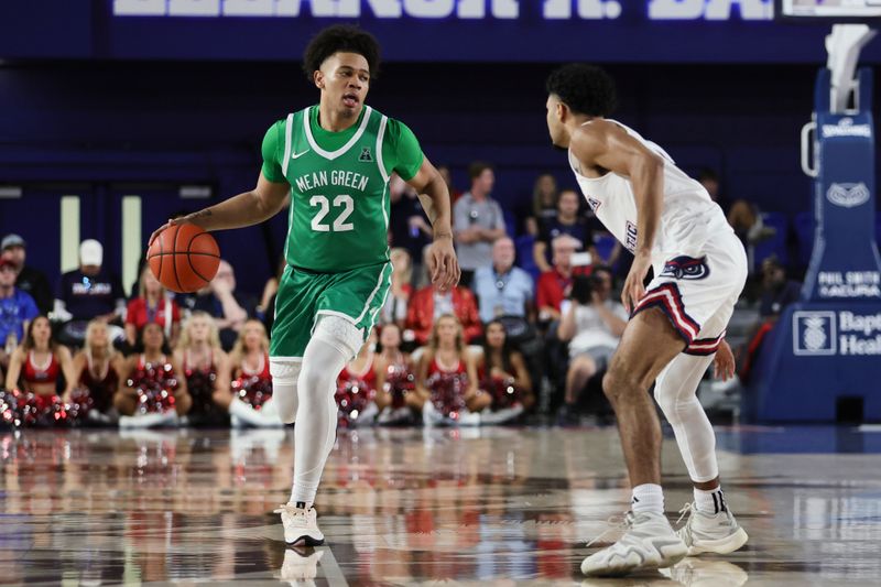 Jan 28, 2024; Boca Raton, Florida, USA; North Texas Mean Green guard CJ Noland (22) dribbles the basketball against the Florida Atlantic Owls during the first half at Eleanor R. Baldwin Arena. Mandatory Credit: Sam Navarro-USA TODAY Sports