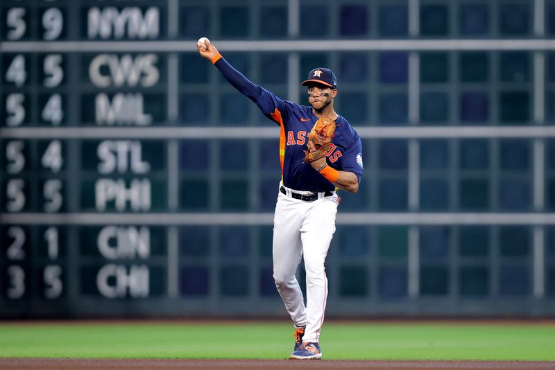 Jun 1, 2024; Houston, Texas, USA; Houston Astros shortstop Jeremy Pena (3) throws a fielded ball to first base for an out against the Minnesota Twins during the first inning at Minute Maid Park. Mandatory Credit: Erik Williams-USA TODAY Sports