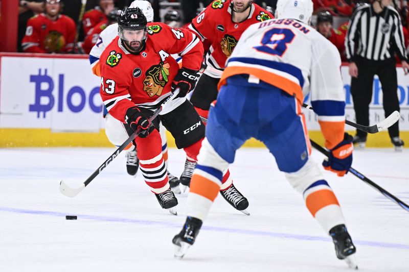 Jan 19, 2024; Chicago, Illinois, USA; Chicago Blackhawks forward Colin Blackwell (43) skates the puck across the blue line in the third period against the New York Islanders at United Center. Mandatory Credit: Jamie Sabau-USA TODAY Sports