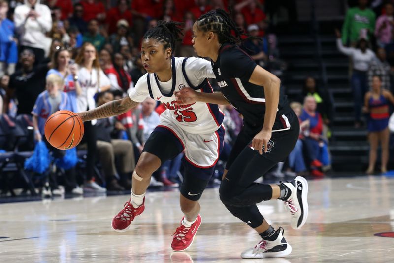 Feb 19, 2023; Oxford, Mississippi, USA; Mississippi Rebels guard Angel Baker (15) dribbles as South Carolina Gamecocks guard Zia Cooke (1) defends during the second half at The Sandy and John Black Pavilion at Ole Miss. Mandatory Credit: Petre Thomas-USA TODAY Sports