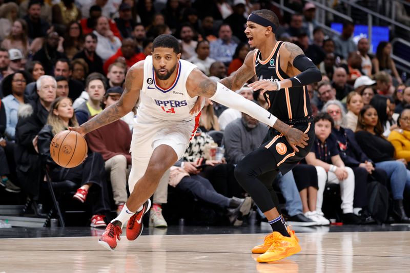 ATLANTA, GA - JANUARY 28: Paul George #13 of the LA Clippers dribbles around Dejounte Murray #5 of the Atlanta Hawks during the second half at State Farm Arena on January 28, 2023 in Atlanta, Georgia. NOTE TO USER: User expressly acknowledges and agrees that,  by downloading and or using this photograph,  User is consenting to the terms and conditions of the Getty Images License Agreement. (Photo by Alex Slitz/Getty Images)