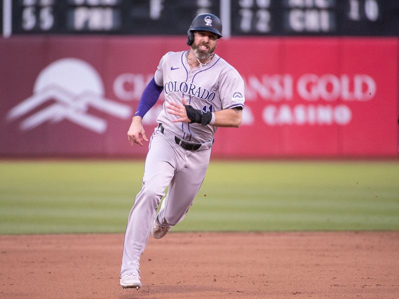 May 21, 2024; Oakland, California, USA; Colorado Rockies outfielder Jake Cave (11) advances to third base on a single by outfielder Brenton Doyle (9, not pictured) during the sixth inning at Oakland-Alameda County Coliseum. Mandatory Credit: Ed Szczepanski-USA TODAY Sports