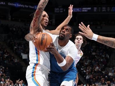 MINNEAPOLIS, MN -  NOVEMBER 28: Naz Reid #11 of the Minnesota Timberwolves handles the ball during the game against the Oklahoma City Thunder uring the In - Season Tournament on November 28, 2023 at Target Center in Minneapolis, Minnesota. NOTE TO USER: User expressly acknowledges and agrees that, by downloading and or using this Photograph, user is consenting to the terms and conditions of the Getty Images License Agreement. Mandatory Copyright Notice: Copyright 2023 NBAE (Photo by David Sherman/NBAE via Getty Images)