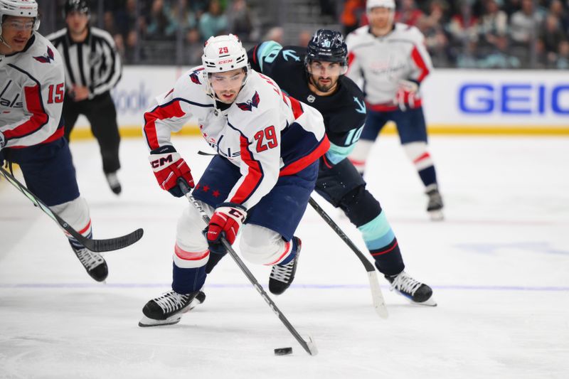 Mar 14, 2024; Seattle, Washington, USA; Washington Capitals center Hendrix Lapierre (29) advances the puck against the Seattle Kraken during the first period at Climate Pledge Arena. Mandatory Credit: Steven Bisig-USA TODAY Sports