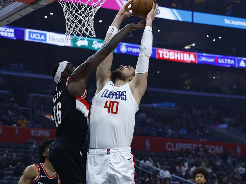 LOS ANGELES, CALIFORNIA - DECEMBER 11:  Ivica Zubac #40 of the LA Clippers takes a shot against Duop Reath #26 of the Portland Trail Blazers in the first half at Crypto.com Arena on December 11, 2023 in Los Angeles, California.  NOTE TO USER: User expressly acknowledges and agrees that, by downloading and/or using this photograph, user is consenting to the terms and conditions of the Getty Images License Agreement. (Photo by Ronald Martinez/Getty Images)