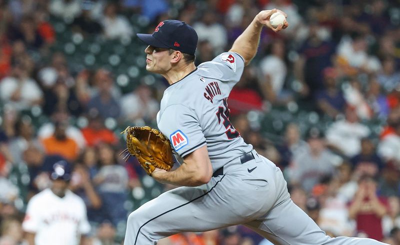 May 1, 2024; Houston, Texas, USA;  Cleveland Guardians relief pitcher Cade Smith (36) delivers a pitch during the ninth inning against the Houston Astros at Minute Maid Park. Mandatory Credit: Troy Taormina-USA TODAY Sports