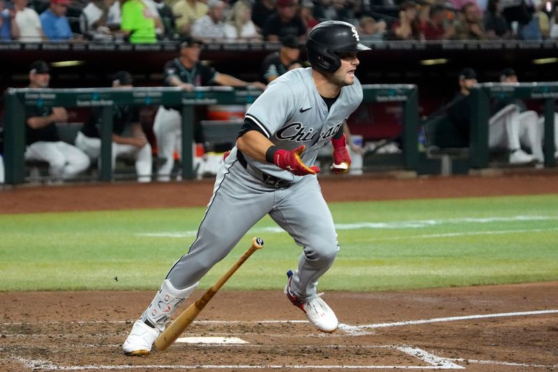 Jun 14, 2024; Phoenix, Arizona, USA; Chicago White Sox outfielder Andrew Benintendi (23) hits a double against the Arizona Diamondbacks in the fourth inning at Chase Field. Mandatory Credit: Rick Scuteri-USA TODAY Sports