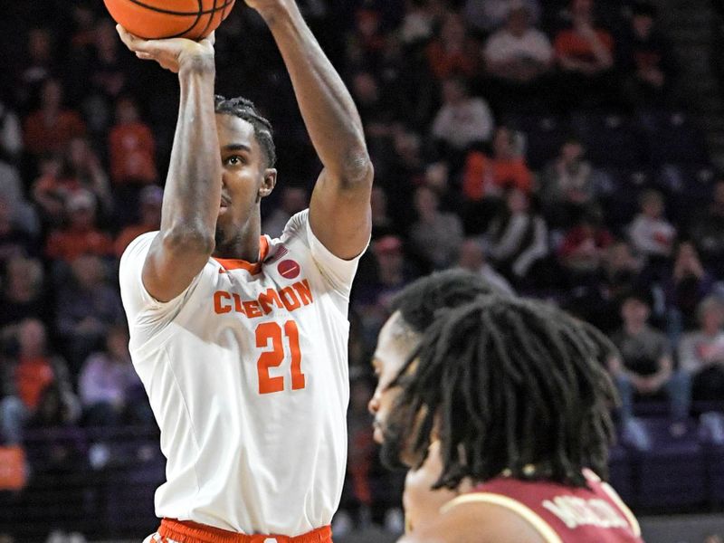 Jan 13, 2024; Clemson, South Carolina, USA; Clemson Tigers forward Chauncey Wiggins (21) shoots the ball against Boston College Eagles forward Devin McGlockton (21) during the first half at Littlejohn Coliseum. Mandatory Credit: Ken Ruinard-USA TODAY Sports