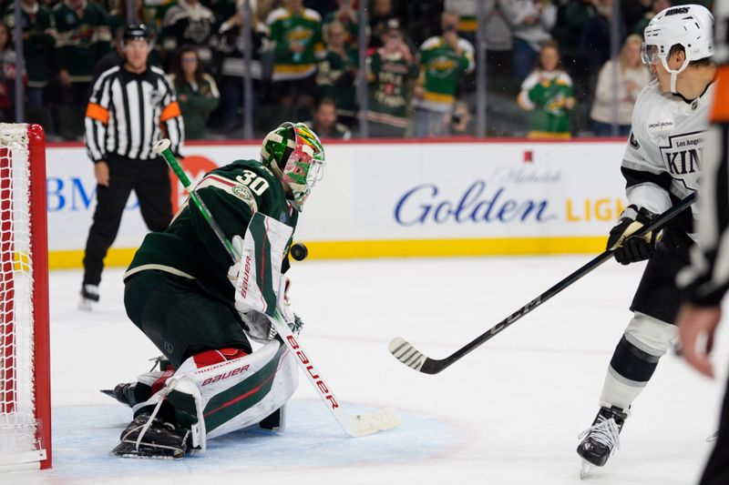 Oct 13, 2025; Saint Paul, Minnesota, USA; Minnesota Wild goaltender Jesper Wallstedt (30) stops Los Angeles Kings left wing Andrei Kuzmenko (96) in shootouts to win the game 4-3 at Grand Casino Arena. Mandatory Credit: Matt Blewett-Imagn Images