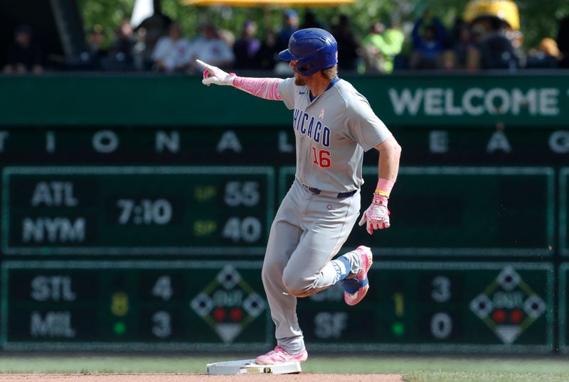 May 12, 2024; Pittsburgh, Pennsylvania, USA;  Chicago Cubs first baseman Patrick Wisdom (16) circles the bases on a solo home run against the Pittsburgh Pirates during the tenth inning at PNC Park. The Cubs won 5-4 in ten innings. Mandatory Credit: Charles LeClaire-USA TODAY Sports