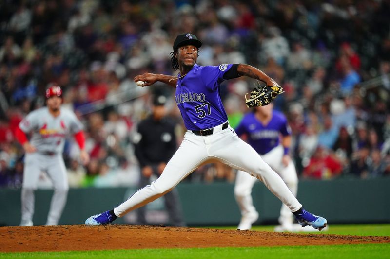 Sep 24, 2024; Denver, Colorado, USA; Colorado Rockies relief pitcher Angel Chivilli (57) pitches in the eighth inning against the St. Louis Cardinals at Coors Field. Mandatory Credit: Ron Chenoy-Imagn Images