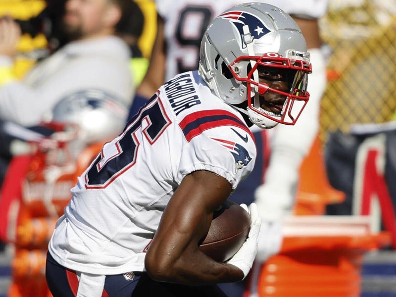 New England Patriots wide receiver Nelson Agholor (15) runs the ball during an NFL football game against the Green Bay Packers Sunday, Oct. 2, 2022, in Green Bay, Wis. (AP Photo/Jeffrey Phelps)