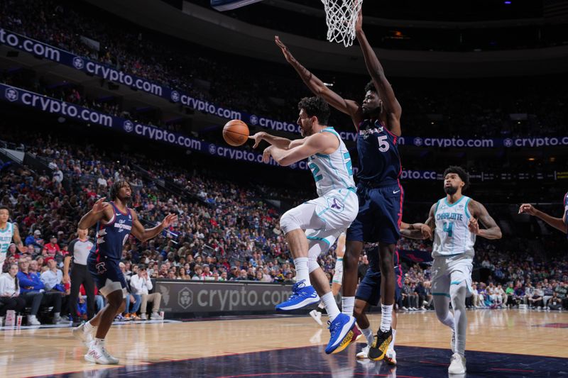 PHILADELPHIA, PA - MARCH 16: Vasilije Micic #22 of the Charlotte Hornets  passes the ball during the game against the Philadelphia 76ers on March 16, 2024 at the Wells Fargo Center in Philadelphia, Pennsylvania NOTE TO USER: User expressly acknowledges and agrees that, by downloading and/or using this Photograph, user is consenting to the terms and conditions of the Getty Images License Agreement. Mandatory Copyright Notice: Copyright 2024 NBAE (Photo by Jesse D. Garrabrant/NBAE via Getty Images)