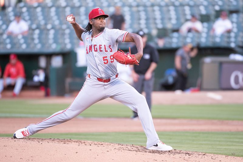 Jul 2, 2024; Oakland, California, USA; Los Angeles Angels pitcher José Soriano (59) throws a pitch against the Oakland Athletics during the fourth inning at Oakland-Alameda County Coliseum. Mandatory Credit: Ed Szczepanski-USA TODAY Sports