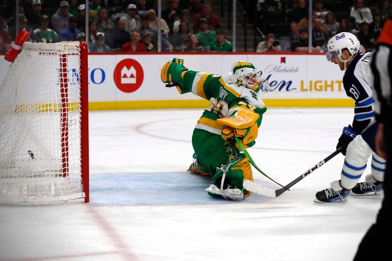 Apr 6, 2024; Saint Paul, Minnesota, USA;  Winnipeg Jets left wing Kyle Connor (81) scores a goal against Minnesota Wild goaltender Marc-Andre Fleury (29) during the first period at Xcel Energy Center. Mandatory Credit: Bruce Fedyck-USA TODAY Sports