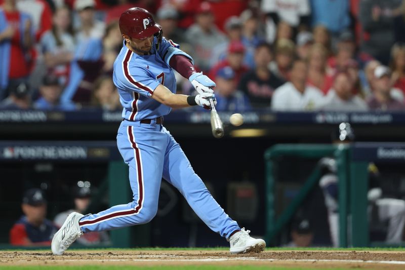 Oct 12, 2023; Philadelphia, Pennsylvania, USA; Philadelphia Phillies shortstop Trea Turner (7) hits a double against the Atlanta Braves during the first inning in game four of the NLDS of the 2023 MLB playoffs at Citizens Bank Park. Mandatory Credit: Bill Streicher-USA TODAY Sports