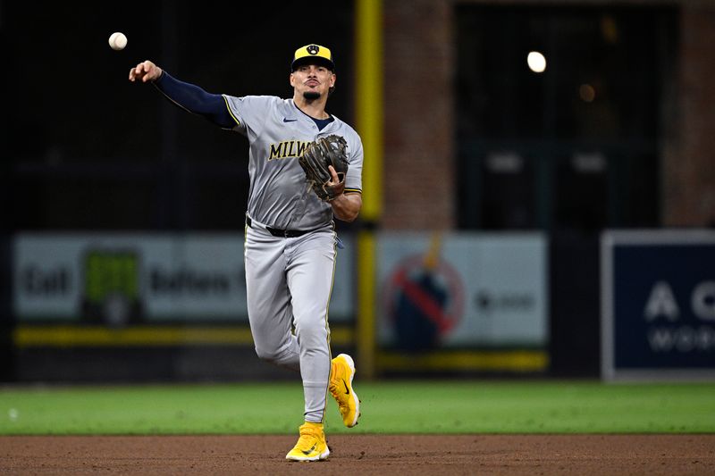 Jun 20, 2024; San Diego, California, USA; Milwaukee Brewers shortstop Willy Adames (27) throws to first base on a ground out by San Diego Padres shortstop Ha-Seong Kim (not pictured) during the sixth inning at Petco Park. Mandatory Credit: Orlando Ramirez-USA TODAY Sports