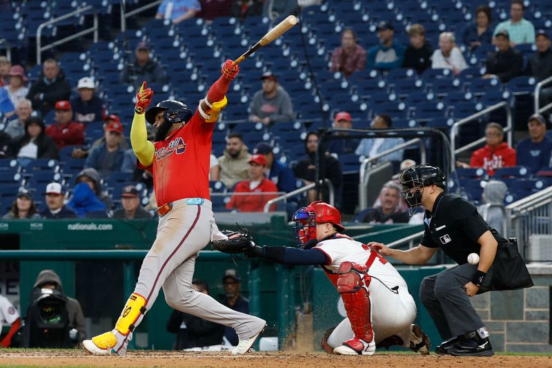 Sep 17, 2025; Washington, District of Columbia, USA; Atlanta Braves designated hitter Marcell Ozuna (20) hits an RBI double against the Washington Nationals during the eighth inning at Nationals Park. Mandatory Credit: Geoff Burke-Imagn Images