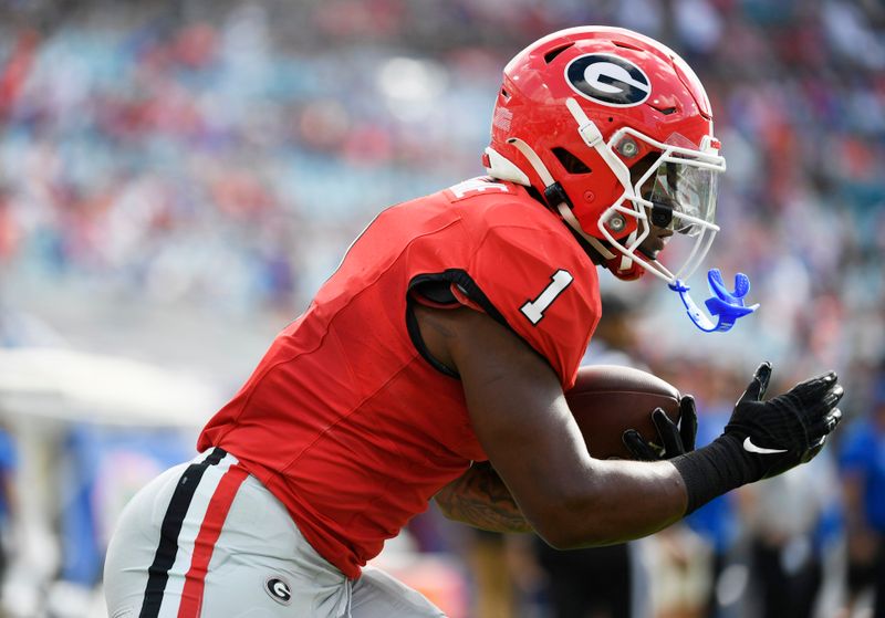 Nov 2, 2024; Jacksonville, Florida, USA; Georgia Bulldogs running back Trevor Etienne (1) warms up before a game against the Florida Gators at EverBank Stadium. Mandatory Credit: Melina Myers-Imagn Images