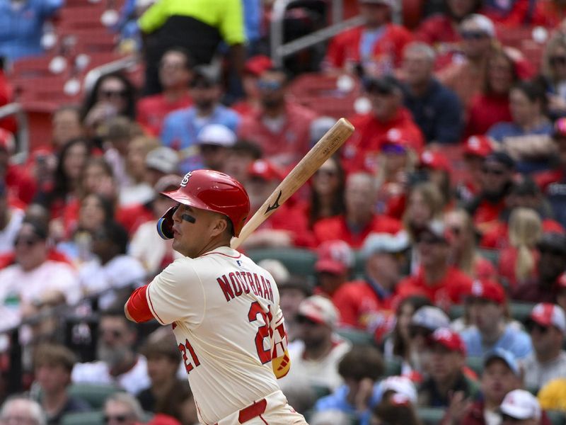 Apr 26, 2025; St. Louis, Missouri, USA;  St. Louis Cardinals right fielder Lars Nootbaar (21) hits a one run double against the Milwaukee Brewers during the third inning at Busch Stadium. Mandatory Credit: Jeff Curry-Imagn Images