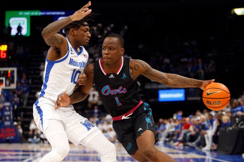 Feb 25, 2024; Memphis, Tennessee, USA; Florida Atlantic Owls guard Johnell Davis (1) drives to the basket as Memphis Tigers guard Jaykwon Walton (10) defends during the second half at FedExForum. Mandatory Credit: Petre Thomas-USA TODAY Sports