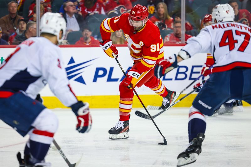 Mar 18, 2024; Calgary, Alberta, CAN; Calgary Flames center Nazem Kadri (91) shoots the puck against the Washington Capitals during the second period at Scotiabank Saddledome. Mandatory Credit: Sergei Belski-USA TODAY Sports