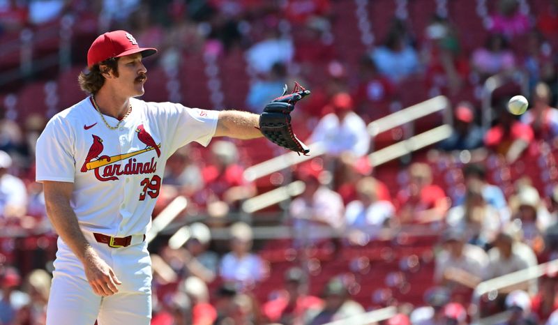 Aug 28, 2025; St. Louis, Missouri, USA; St. Louis Cardinals pitcher Miles Mikolas (39) catches the ball in a game against the Pittsburgh Pirates at Busch Stadium. Mandatory Credit: Tim Vizer-Imagn Images
