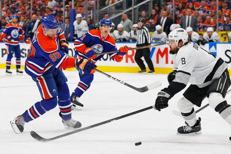 May 1, 2024; Edmonton, Alberta, CAN;Edmonton Oilers forward Corey Perry (90) gets a shot away in front of Los Angeles Kings defensemen Drew Doughty (8) during the first period in game five of the first round of the 2024 Stanley Cup Playoffs at Rogers Place. Mandatory Credit: Perry Nelson-USA TODAY Sports