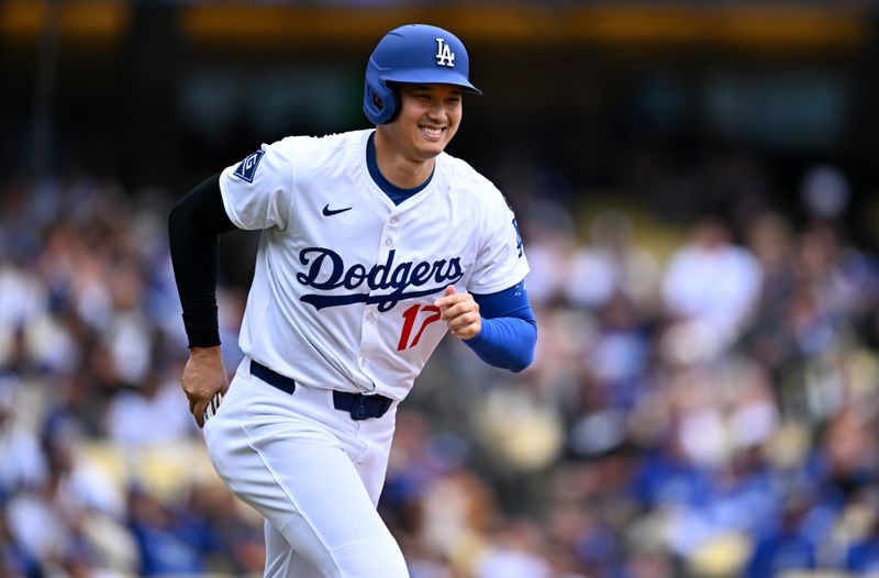 Apr 27, 2025; Los Angeles, California, USA; Los Angeles Dodgers designated hitter Shohei Ohtani (17) reacts after walking in the first inning against the Pittsburgh Pirates at Dodger Stadium. Mandatory Credit: Jonathan Hui-Imagn Images