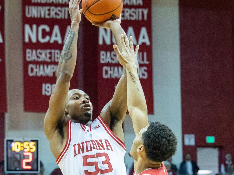 Jan 14, 2023; Bloomington, Indiana, USA; Indiana Hoosiers guard Tamar Bates (53)  shoots the ball while Wisconsin Badgers guard Jordan Davis (2) defends in the first half at Simon Skjodt Assembly Hall. Mandatory Credit: Trevor Ruszkowski-USA TODAY Sports