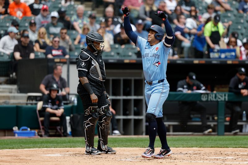 May 27, 2024; Chicago, Illinois, USA; Toronto Blue Jays outfielder George Springer (4) crosses home plate after hitting a two-run home run against the Chicago White Sox during the second inning at Guaranteed Rate Field. Mandatory Credit: Kamil Krzaczynski-USA TODAY Sports