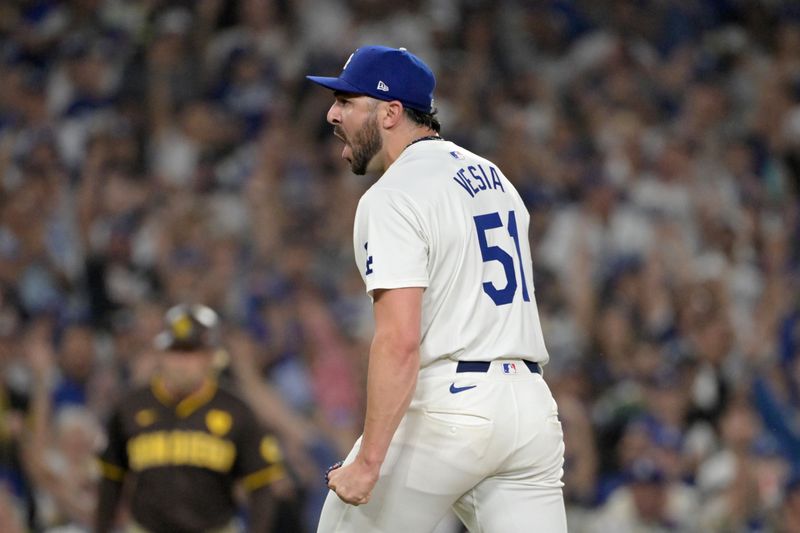 Oct 11, 2024; Los Angeles, California, USA; Los Angeles Dodgers pitcher Alex Vesia (51) reacts in the seventh inning  against the San Diego Padres during game five of the NLDS for the 2024 MLB Playoffs at Dodger Stadium. Mandatory Credit: Jayne Kamin-Oncea-Imagn Images