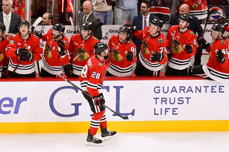 Oct 13, 2025; Chicago, Illinois, USA;  Chicago Blackhawks left wing Andre Burakovsky (28) celebrates with teammates after he scores past Utah Mammoth goaltender Vitek Vanecek (41) during the third period at United Center. Mandatory Credit: Matt Marton-Imagn Images