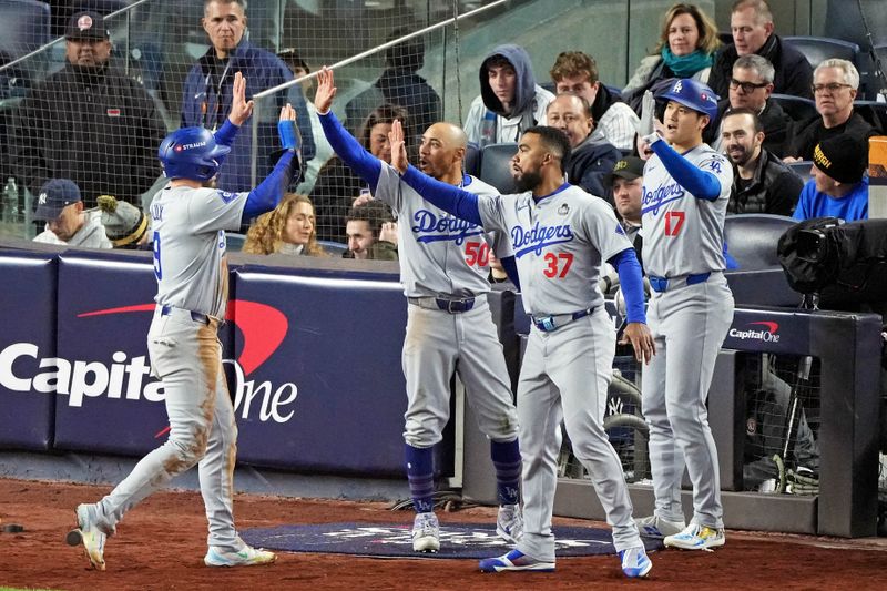 Oct 28, 2024; New York, New York, USA; Los Angeles Dodgers second baseman Gavin Lux (9) celebrates with his teammates after scoring a run during the sixth inning against the New York Yankees in game three of the 2024 MLB World Series at Yankee Stadium. Mandatory Credit: Robert Deutsch-Imagn Images