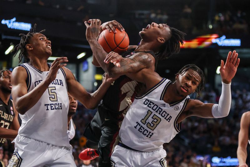 Mar 2, 2024; Atlanta, Georgia, USA; Florida State Seminoles forward Jamir Watkins (2) grabs a rebound past Georgia Tech Yellow Jackets forward Tafara Gapare (5) and guard Miles Kelly (13) in the first half at McCamish Pavilion. Mandatory Credit: Brett Davis-USA TODAY Sports
