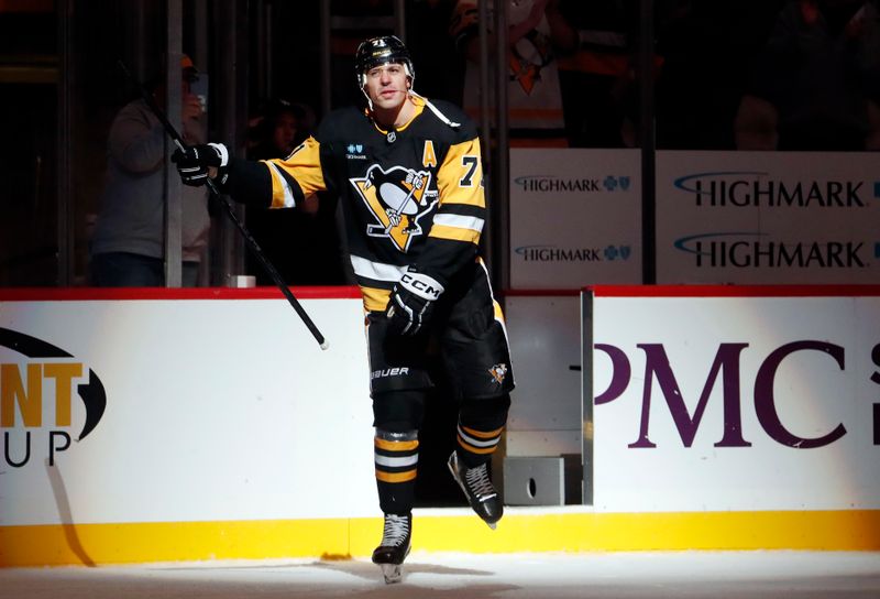 Oct 16, 2024; Pittsburgh, Pennsylvania, USA; Pittsburgh Penguins center Evgeni Malkin (71) reacts after being named first star of the game against the Buffalo Sabres in overtime at PPG Paints Arena. Malkin recorded NHL career goal number 500 in the contest. Mandatory Credit: Charles LeClaire-Imagn Images