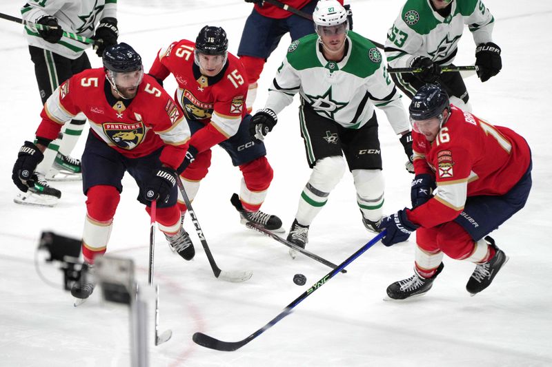 Dec 6, 2023; Sunrise, Florida, USA; Florida Panthers center Aleksander Barkov (16) looks to clear the puck against the Dallas Stars during the second period at Amerant Bank Arena. Mandatory Credit: Jim Rassol-USA TODAY Sports