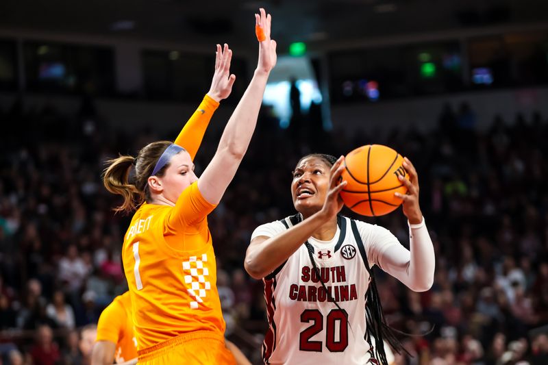 Mar 3, 2024; Columbia, South Carolina, USA; South Carolina Gamecocks forward Sania Feagin (20) gets around Tennessee Lady Vols guard Sara Puckett (1) in the first half at Colonial Life Arena. Mandatory Credit: Jeff Blake-USA TODAY Sports