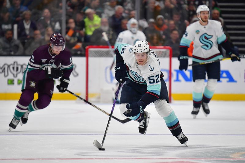 Apr 5, 2024; Anaheim, California, USA; Seattle Kraken left wing Tye Kartye (52) moves the puck against the Anaheim Ducks during the first period at Honda Center. Mandatory Credit: Gary A. Vasquez-USA TODAY Sports