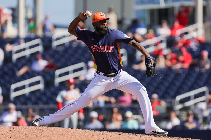 Feb 25, 2024; West Palm Beach, Florida, USA; Houston Astros pitcher Wander Suero (48) delivers a pitch against the St. Louis Cardinals during the sixth inning at CACTI Park of the Palm Beaches. Mandatory Credit: Sam Navarro-USA TODAY Sports