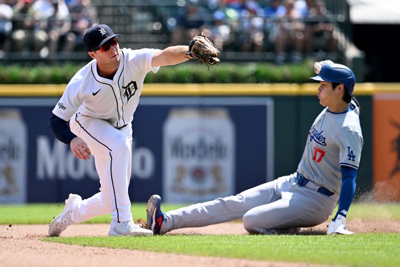 Jul 13, 2024; Detroit, Michigan, USA; Los Angeles Dodgers designated hitter Shohei Ohtani (17) steals second base ahead of the throw to Detroit Tigers second baseman Colt Keith (33) in the eighth inning at Comerica Park. Mandatory Credit: Lon Horwedel-USA TODAY Sports