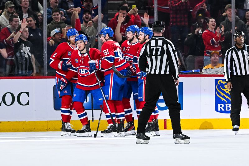 Dec 10, 2023; Montreal, Quebec, CAN; Montreal Canadiens center Jake Evans (71) celebrates his goal against the Nashville Predators with his teammates during the second period at Bell Centre. Mandatory Credit: David Kirouac-USA TODAY Sports