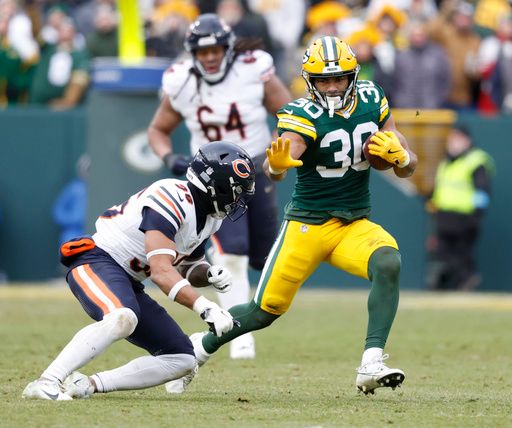 Green Bay Packers running back Chris Brooks (30) runs during an NFL football game against the Chicago Bears Sunday, Jan. 5, 2025, in Green Bay, Wis. (AP Photo/Jeffrey Phelps